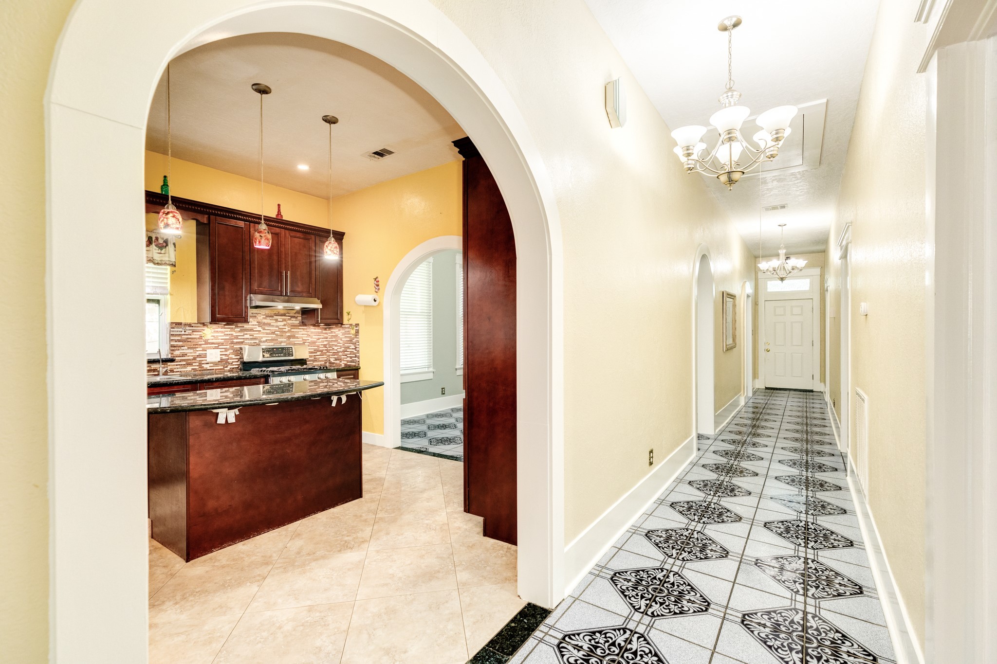 1625 Ave M 1/2 Galveston, TX 77550 - Photo 14 of 24 a kitchen with stainless steel appliances granite countertop a refrigerator and a stove top oven