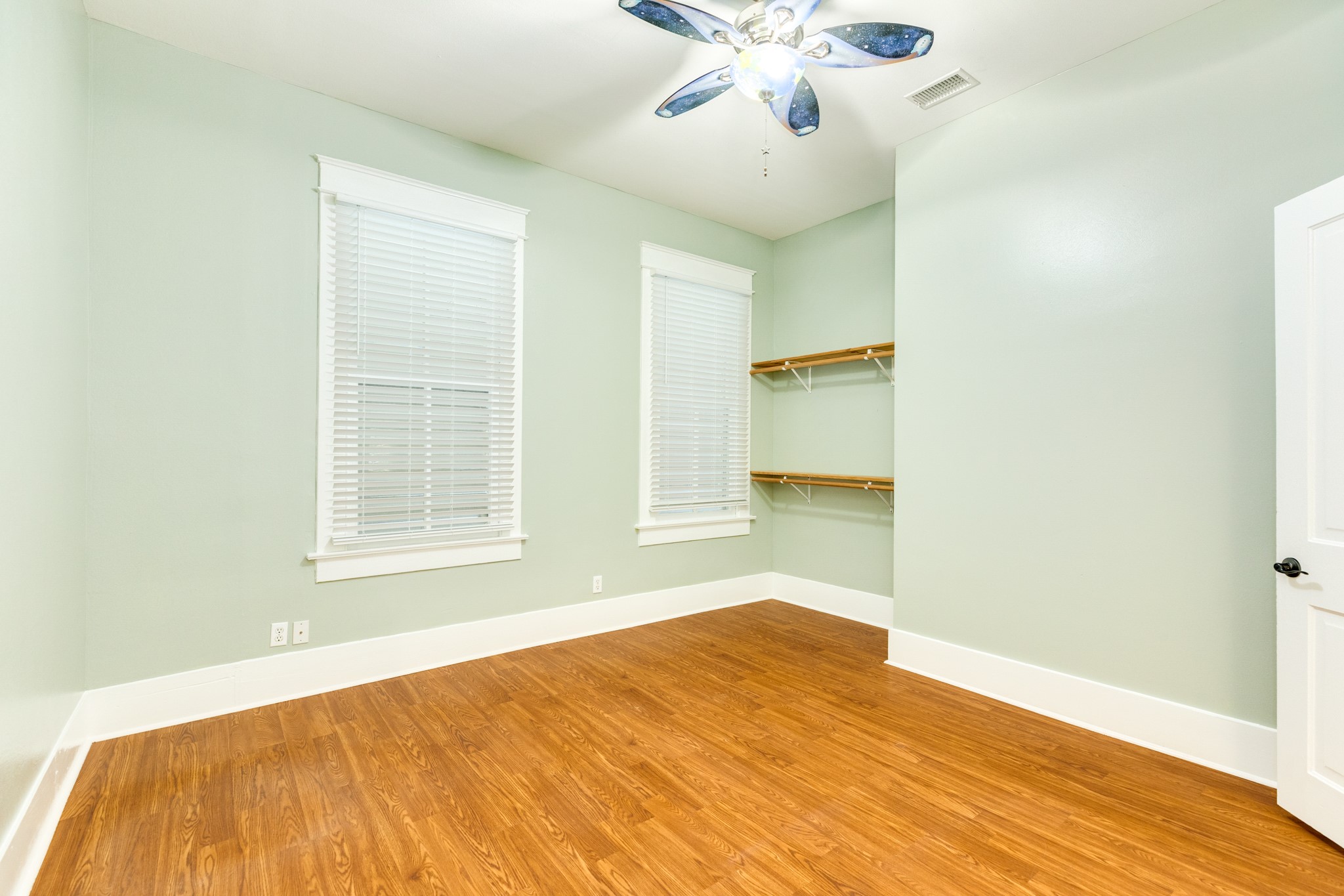 1625 Ave M 1/2 Galveston, TX 77550 - Photo 19 of 24 a bedroom with a bed and a chandelier