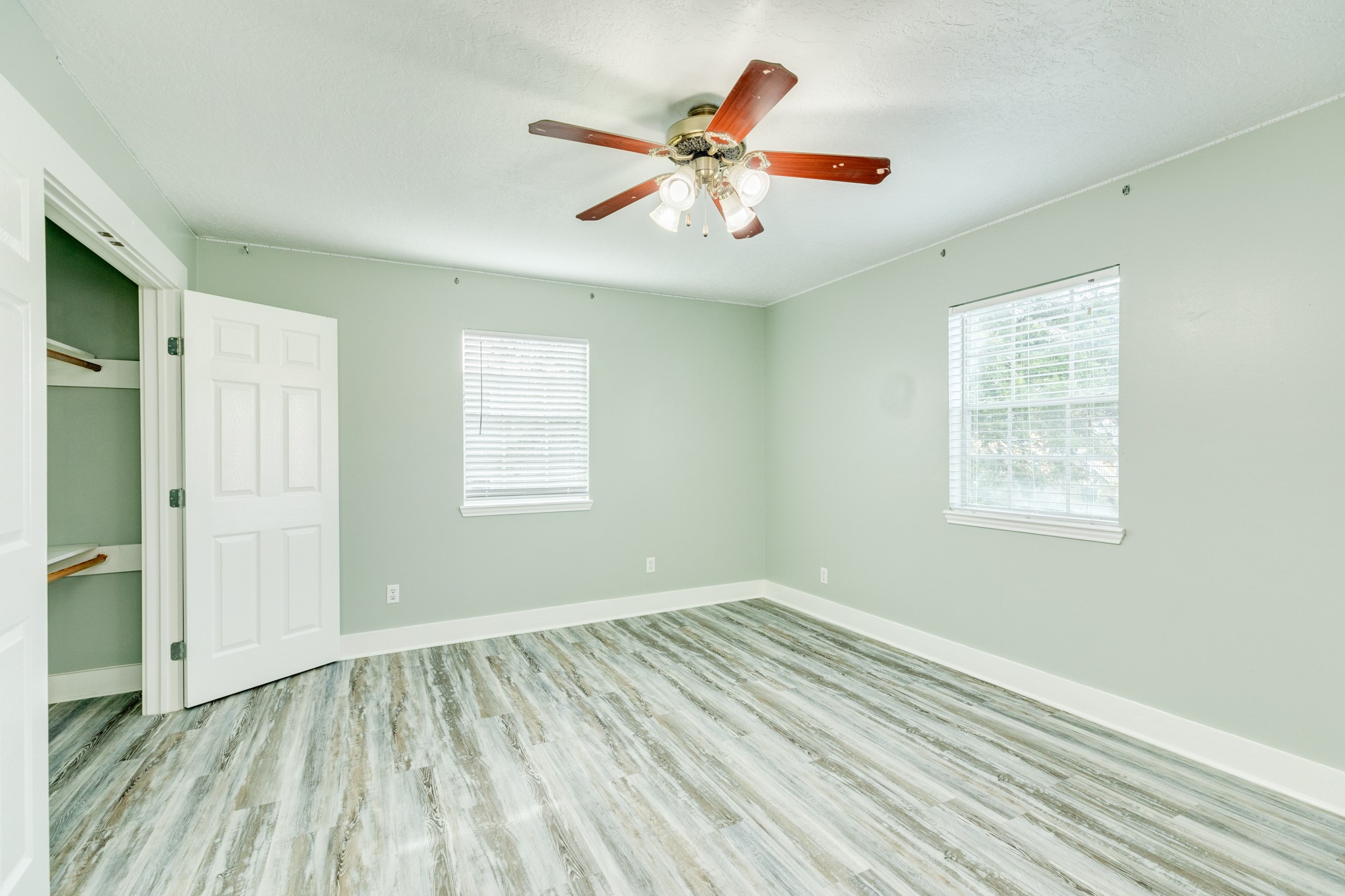 1625 Ave M 1/2 Galveston, TX 77550 - Photo 20 of 24 a view of an empty room with wooden floor and a window