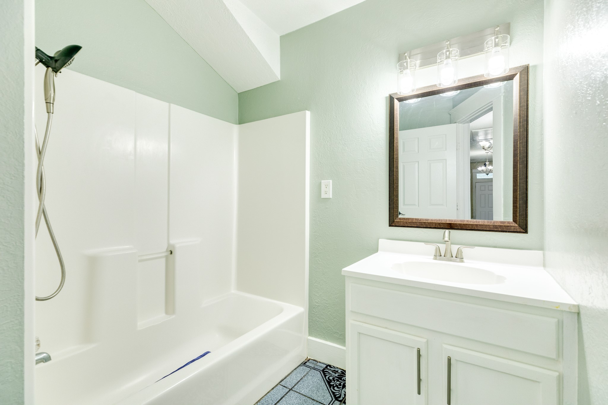 1625 Ave M 1/2 Galveston, TX 77550 - Photo 21 of 24 a bathroom with a bathtub and a sink