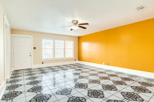 a view of a bedroom with windows