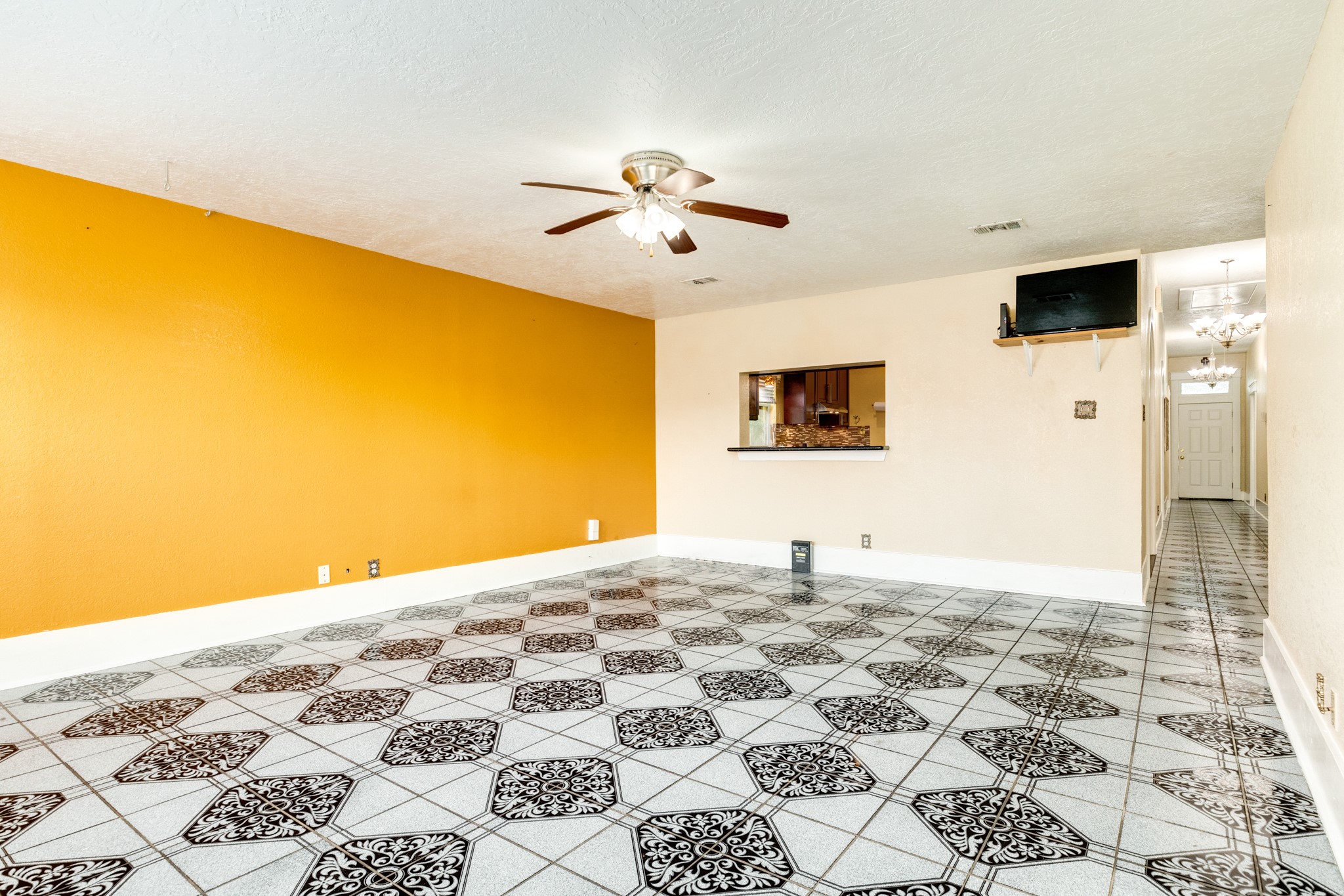 1625 Ave M 1/2 Galveston, TX 77550 - Photo 9 of 24 a bedroom with a bed and a flat screen tv