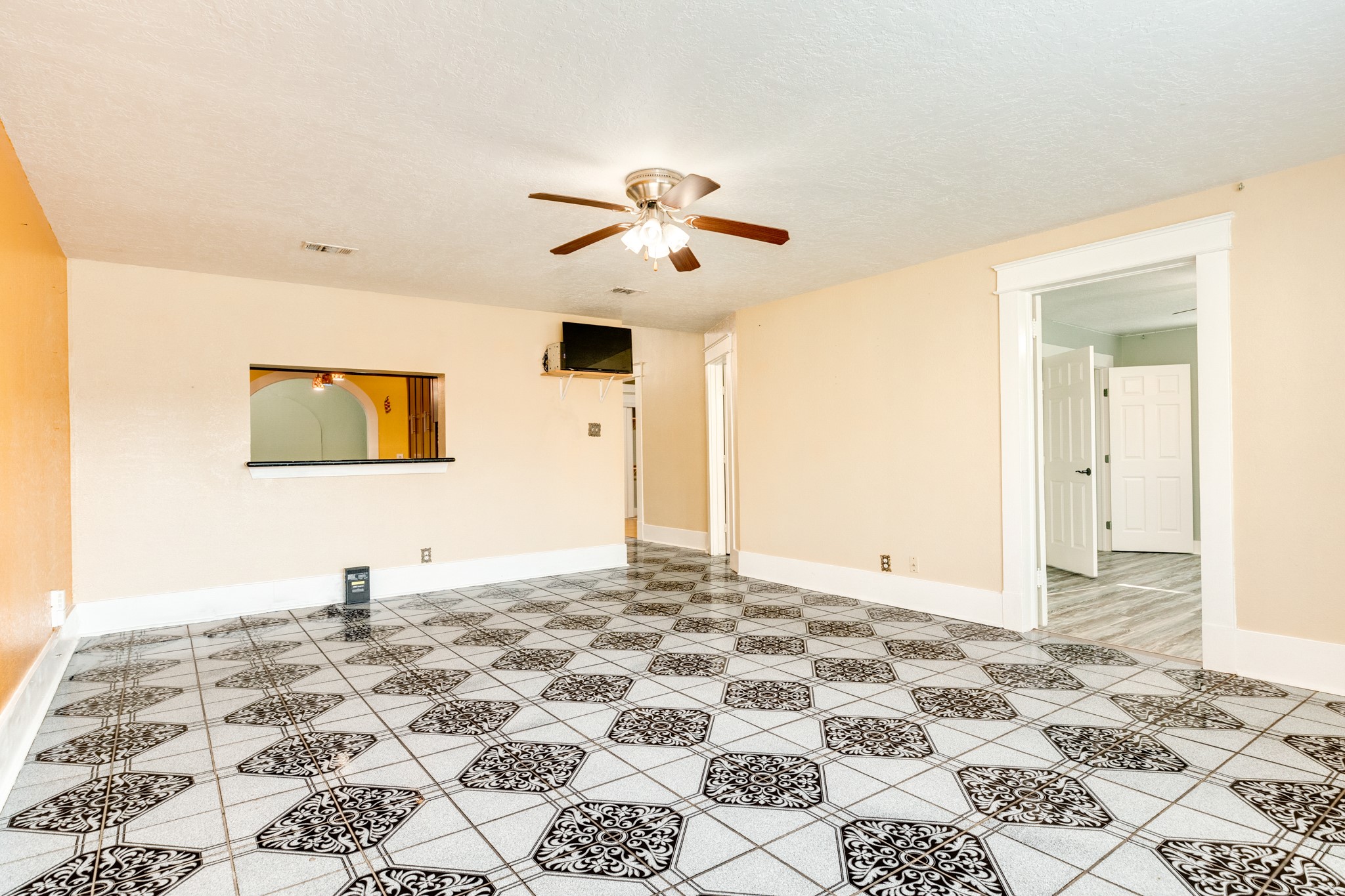 1625 Ave M 1/2 Galveston, TX 77550 - Photo 10 of 24 a view of a bedroom with a sink and a chandelier fan