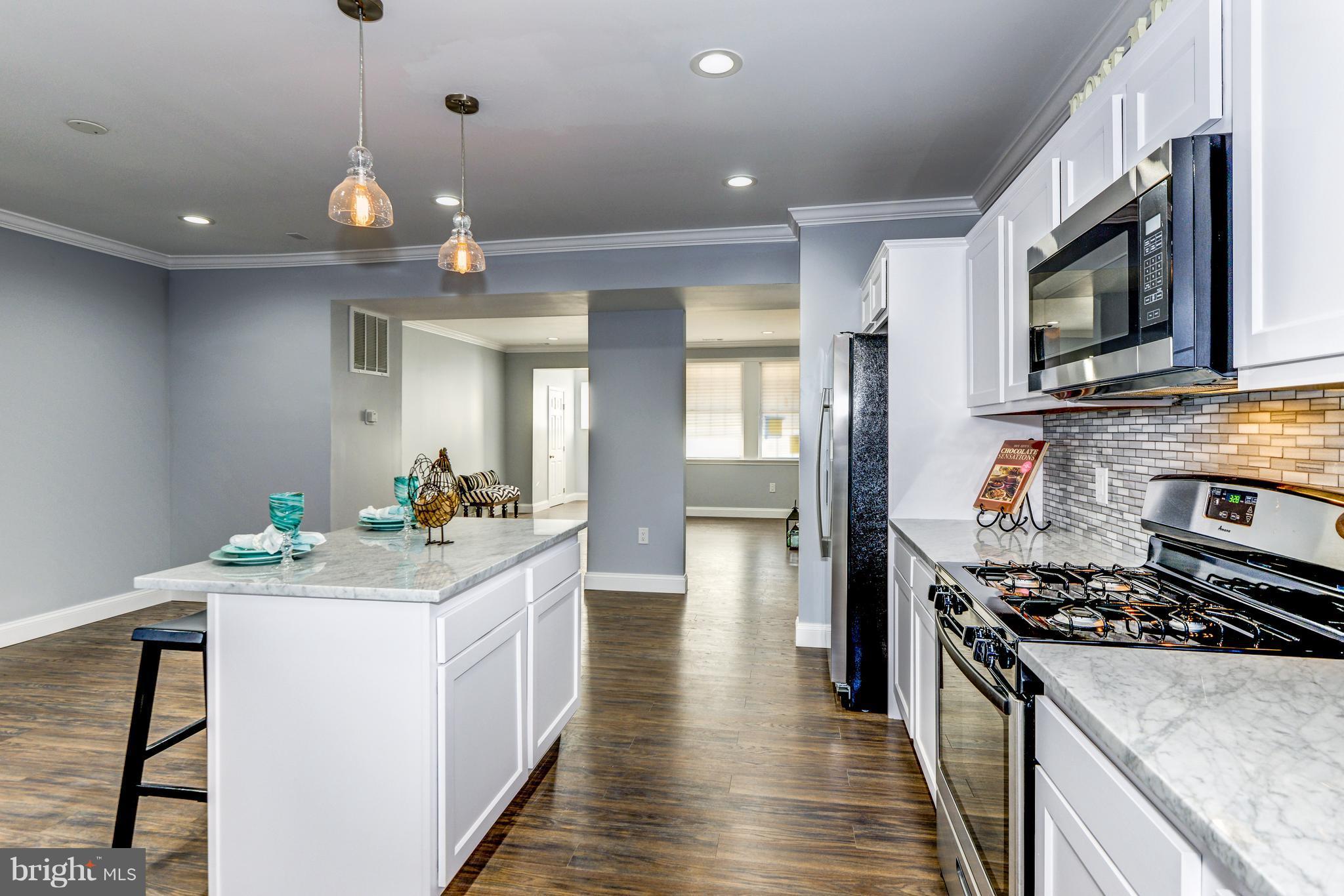 4622 Rokeby Road Baltimore, MD 21229 - Photo 12 of 27 a kitchen with a stove and a sink