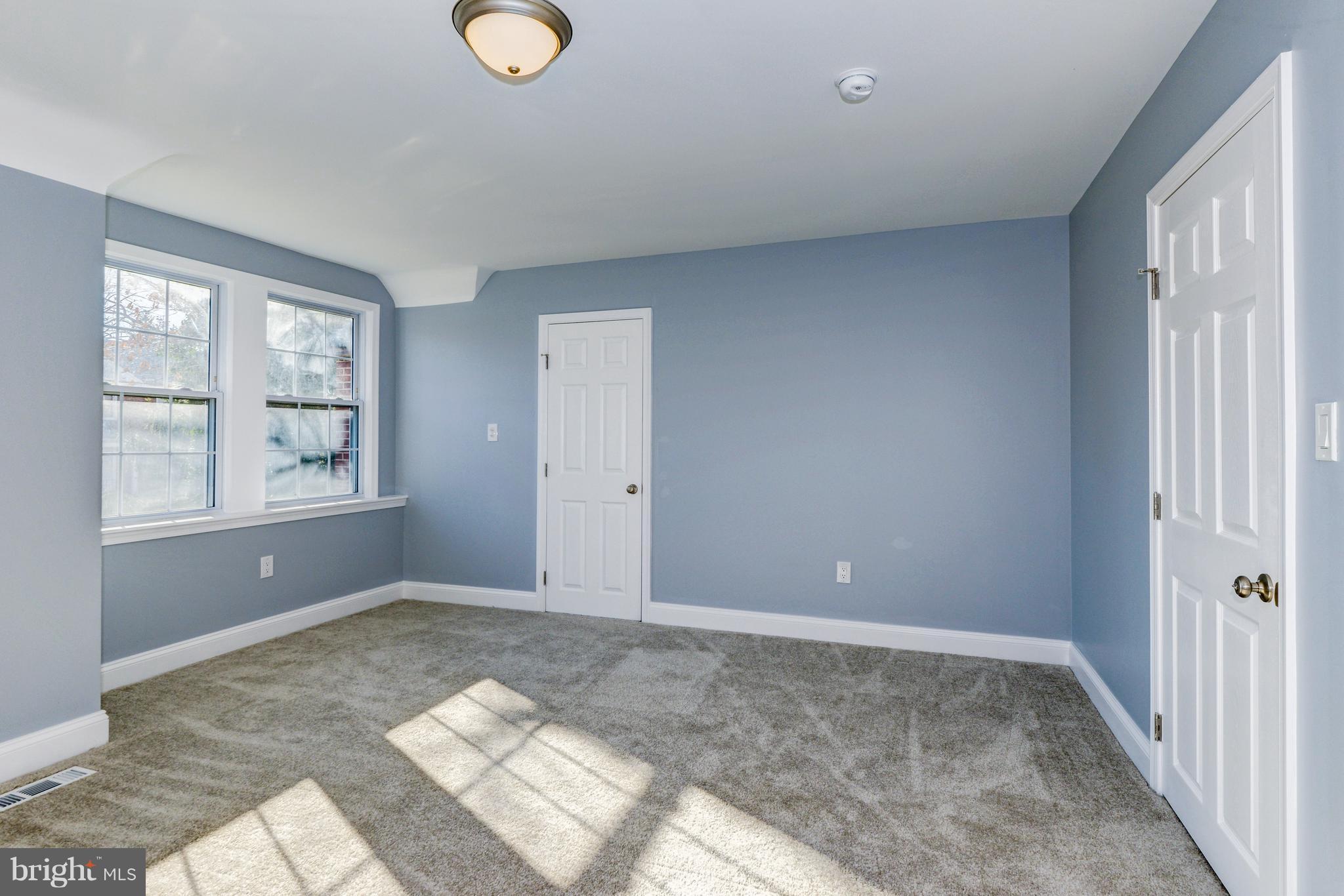 4622 Rokeby Road Baltimore, MD 21229 - Photo 15 of 27 a view of an empty room with window and bathroom