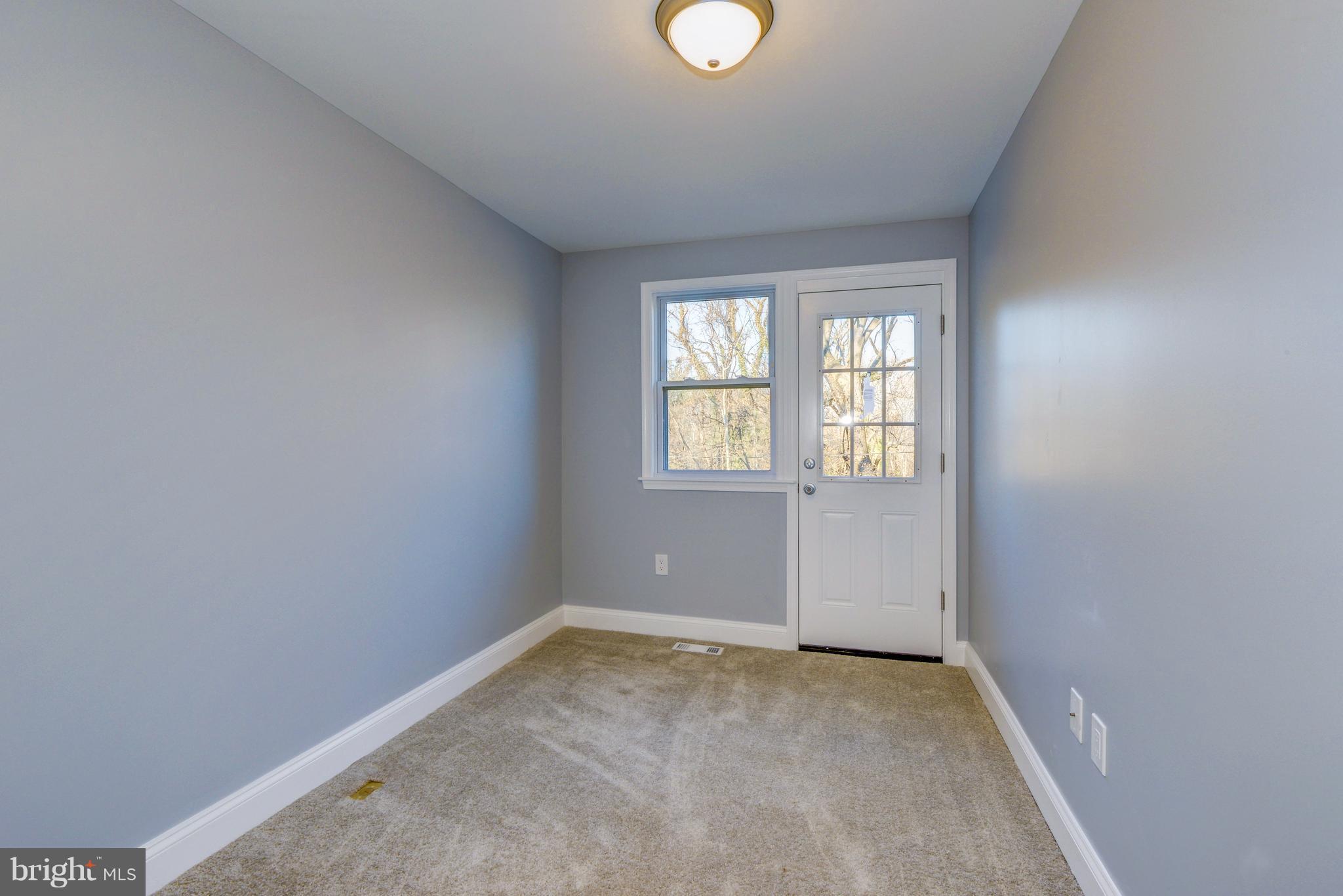 4622 Rokeby Road Baltimore, MD 21229 - Photo 20 of 27 an empty room with windows
