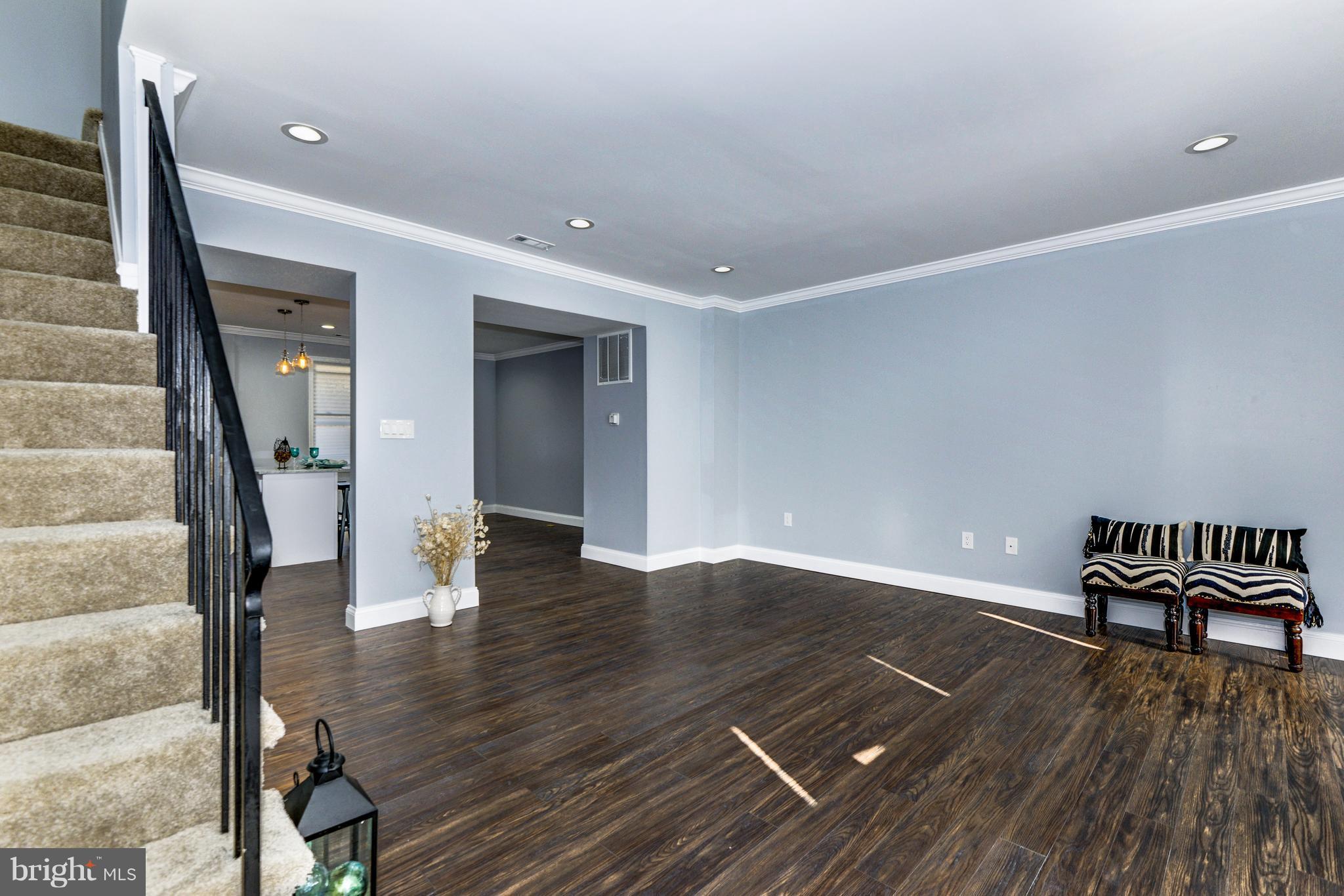 4622 Rokeby Road Baltimore, MD 21229 - Photo 5 of 27 a view of empty room with wooden floor and furniture