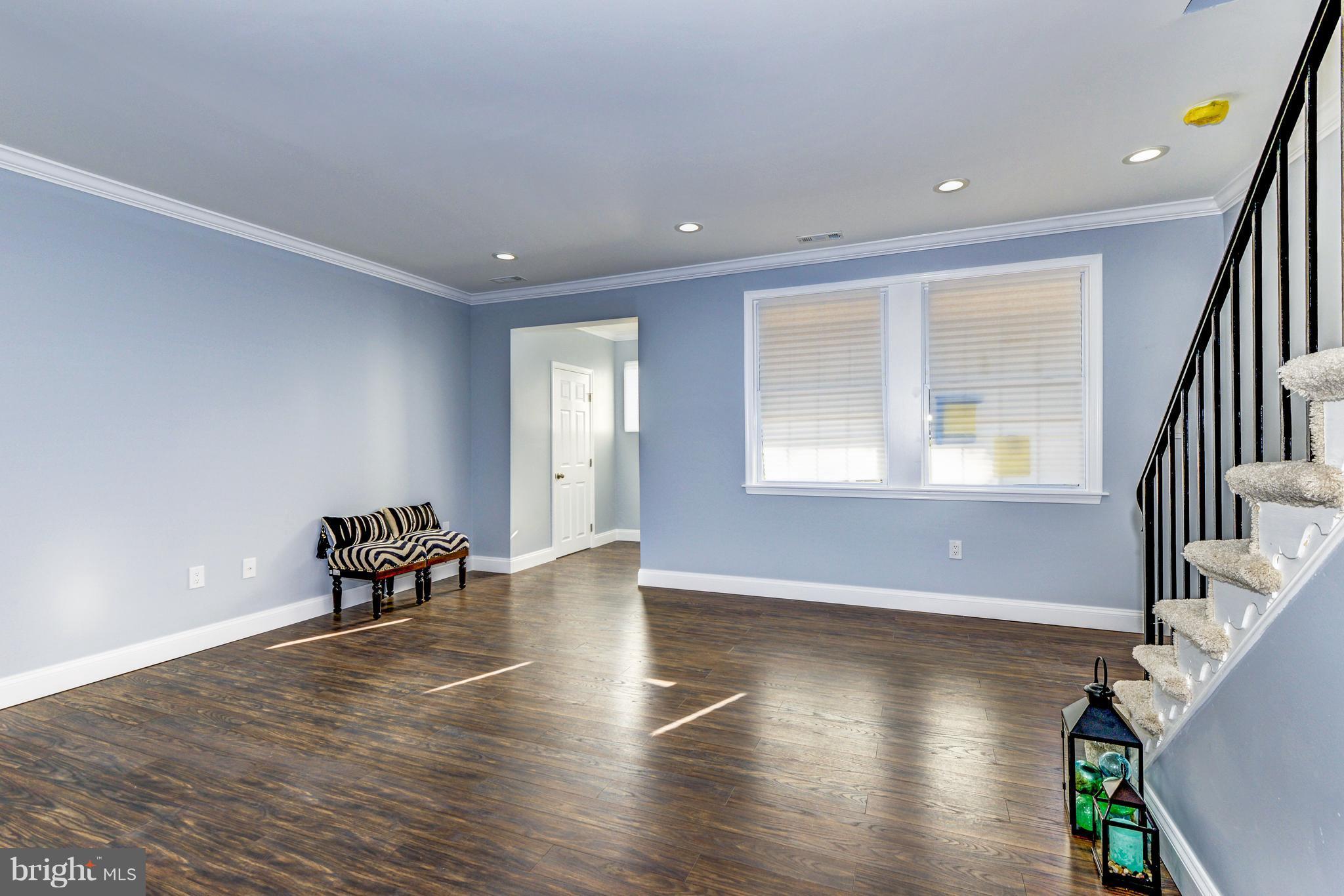 4622 Rokeby Road Baltimore, MD 21229 - Photo 6 of 27 a view of a livingroom with furniture and wooden floor