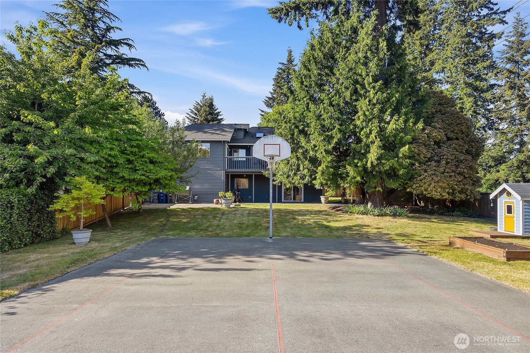 23707 Meridian Place West Bothell, WA 98021 - Photo 32 of 40 a view of a house with a yard and large trees
