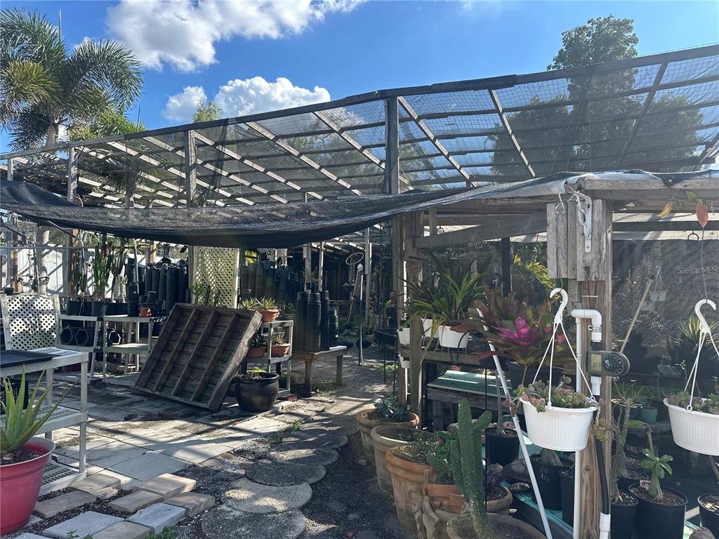 6188 Elliott Street Punta Gorda, FL 33950 - Photo 12 of 19 a view of a patio with wooden chairs