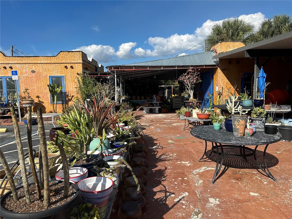 6188 Elliott Street Punta Gorda, FL 33950 - Photo 13 of 19 a view of a chairs and tables in patio
