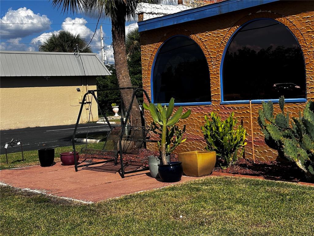 6188 Elliott Street Punta Gorda, FL 33950 - Photo 3 of 19 a view of swimming pool with chairs and wooden fence