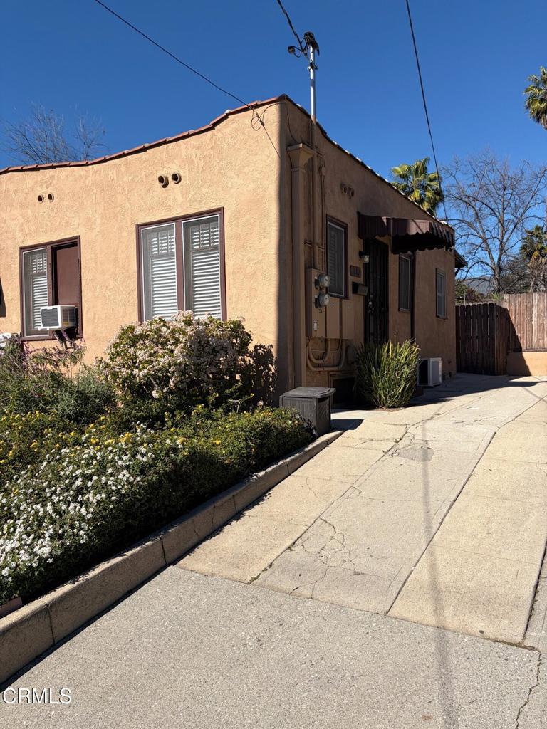 1107 East Howard Street Pasadena, CA 91104 - Photo 2 of 14 a view of a house with a small yard