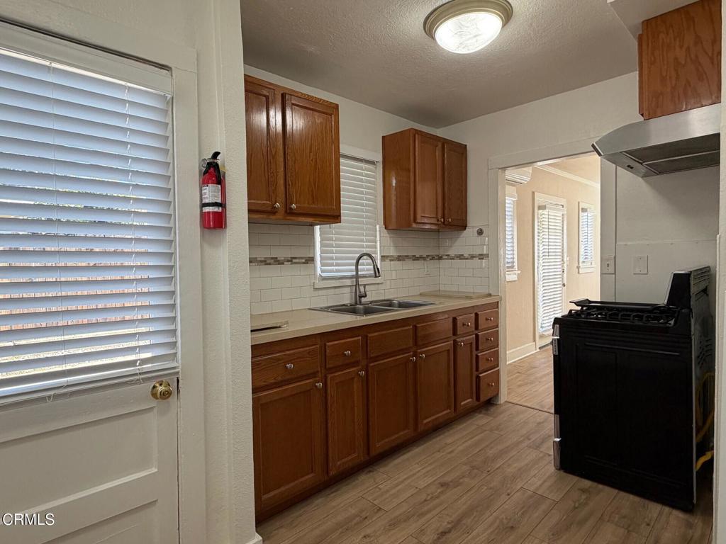 1107 East Howard Street Pasadena, CA 91104 - Photo 7 of 14 a kitchen with a refrigerator and a sink