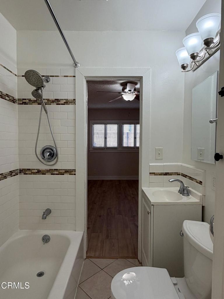 1107 East Howard Street Pasadena, CA 91104 - Photo 9 of 14 a bathroom with a sink a toilet and shower