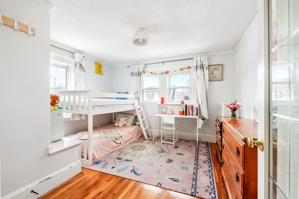 40 Virginia Road Quincy, MA 02169 - Photo 14 of 29 a living room with furniture and a wooden floor