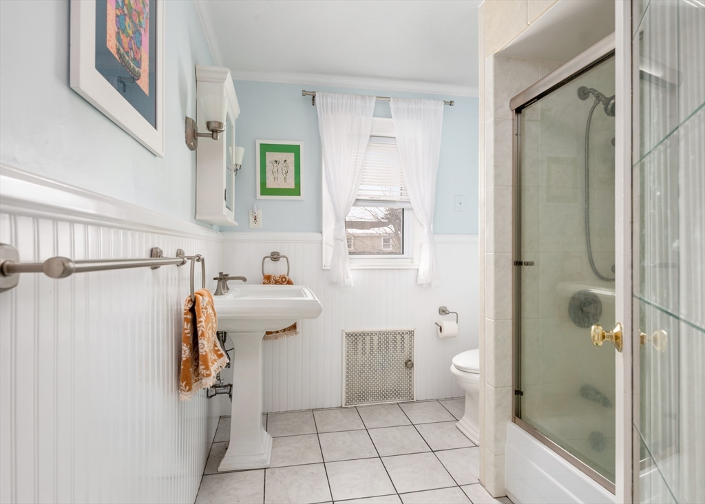 40 Virginia Road Quincy, MA 02169 - Photo 16 of 29 a view of a bathroom with a shower and toilet