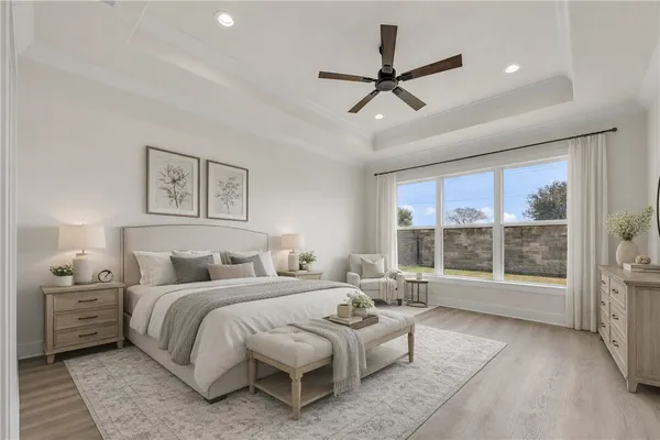 a bedroom with a large bed and a large window