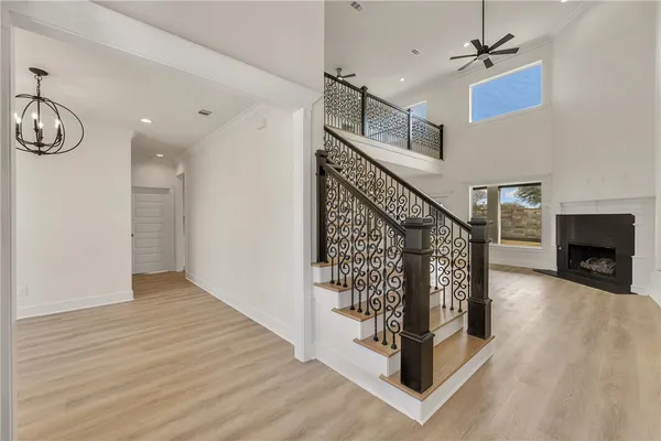 a view of entryway and hall with wooden floor