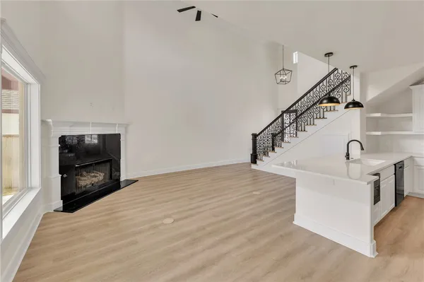 a view of entryway and hall with wooden floor