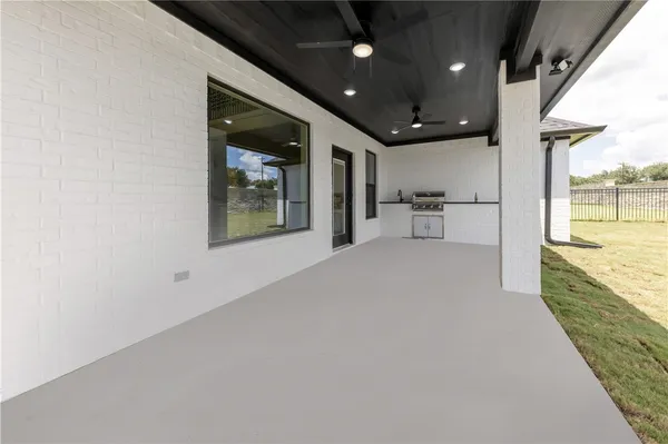 a view of a living room with a large window