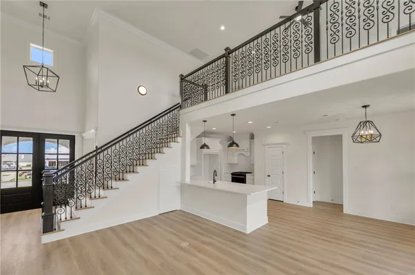 a view of an entryway with wooden floor