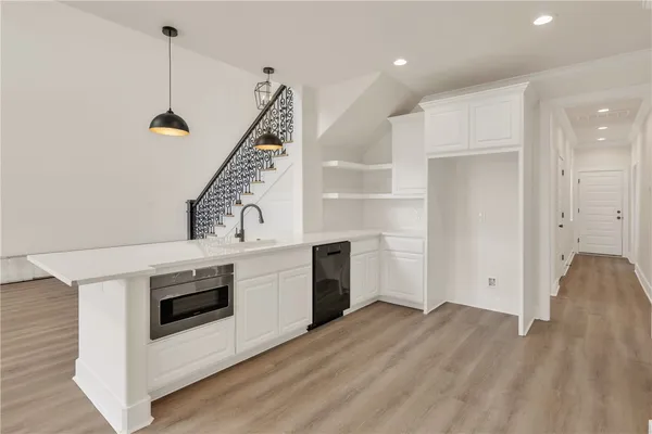 a kitchen with a stove and a microwave