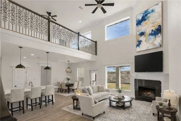 a living room with furniture fireplace and a flat screen tv