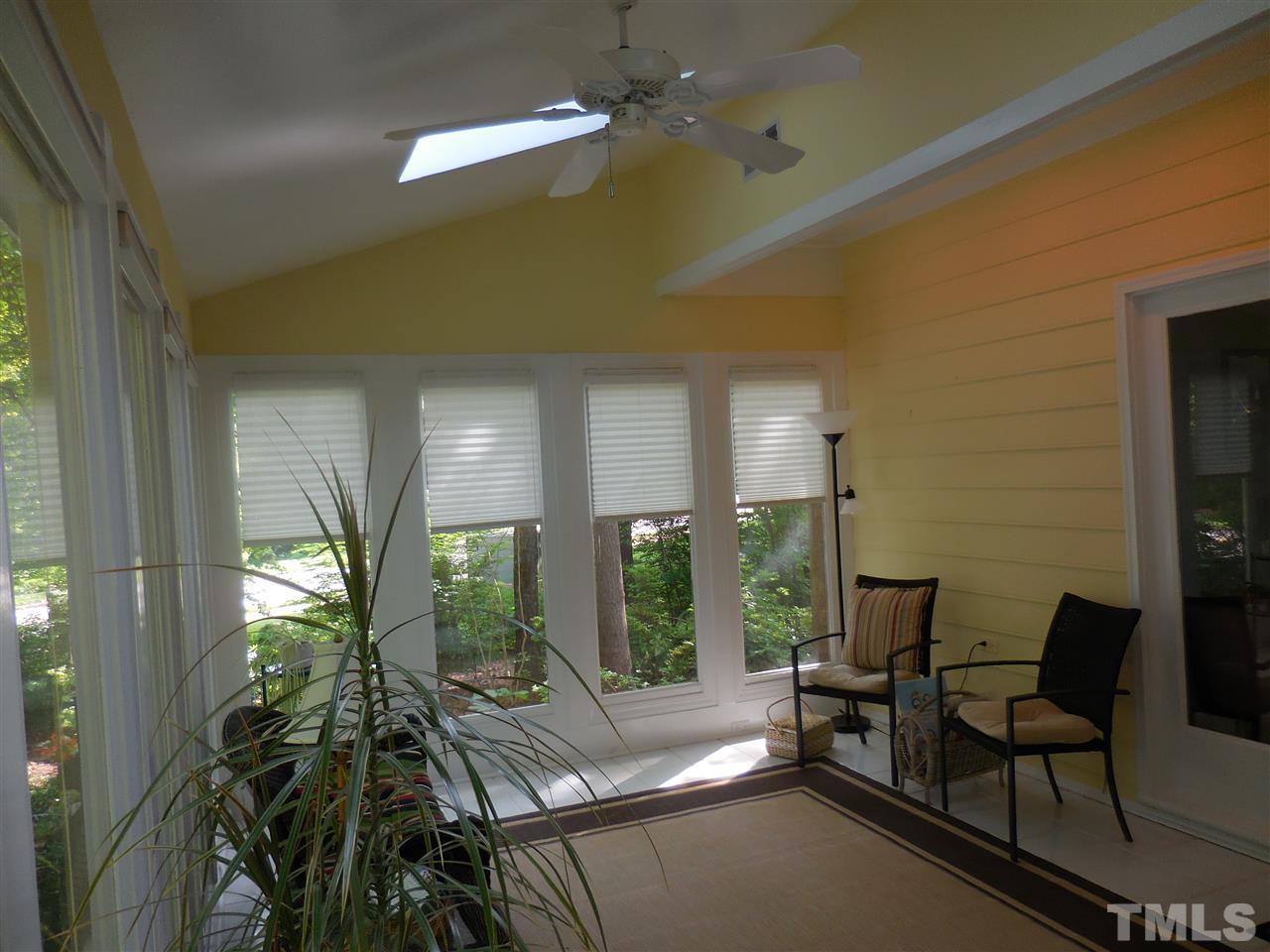 1307 Slatestone Court Raleigh, NC 27615 - Photo 12 of 25 a living room with furniture and a large window