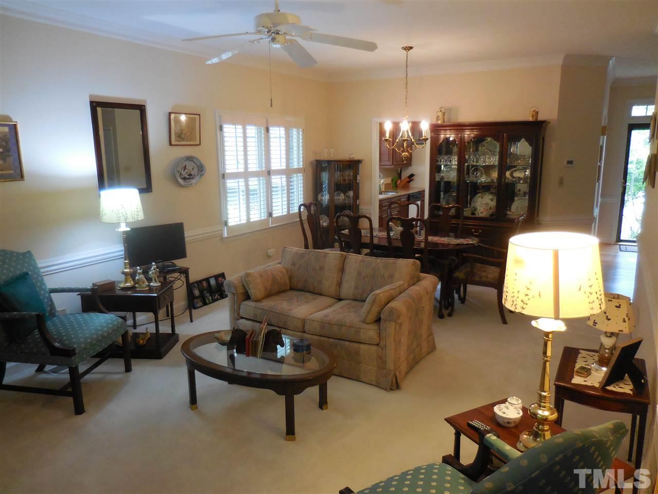 1307 Slatestone Court Raleigh, NC 27615 - Photo 10 of 25 a living room with furniture and wooden floor