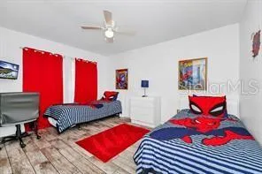 a bedroom with furniture and a chandelier