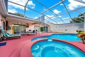 a view of swimming pool with outdoor seating