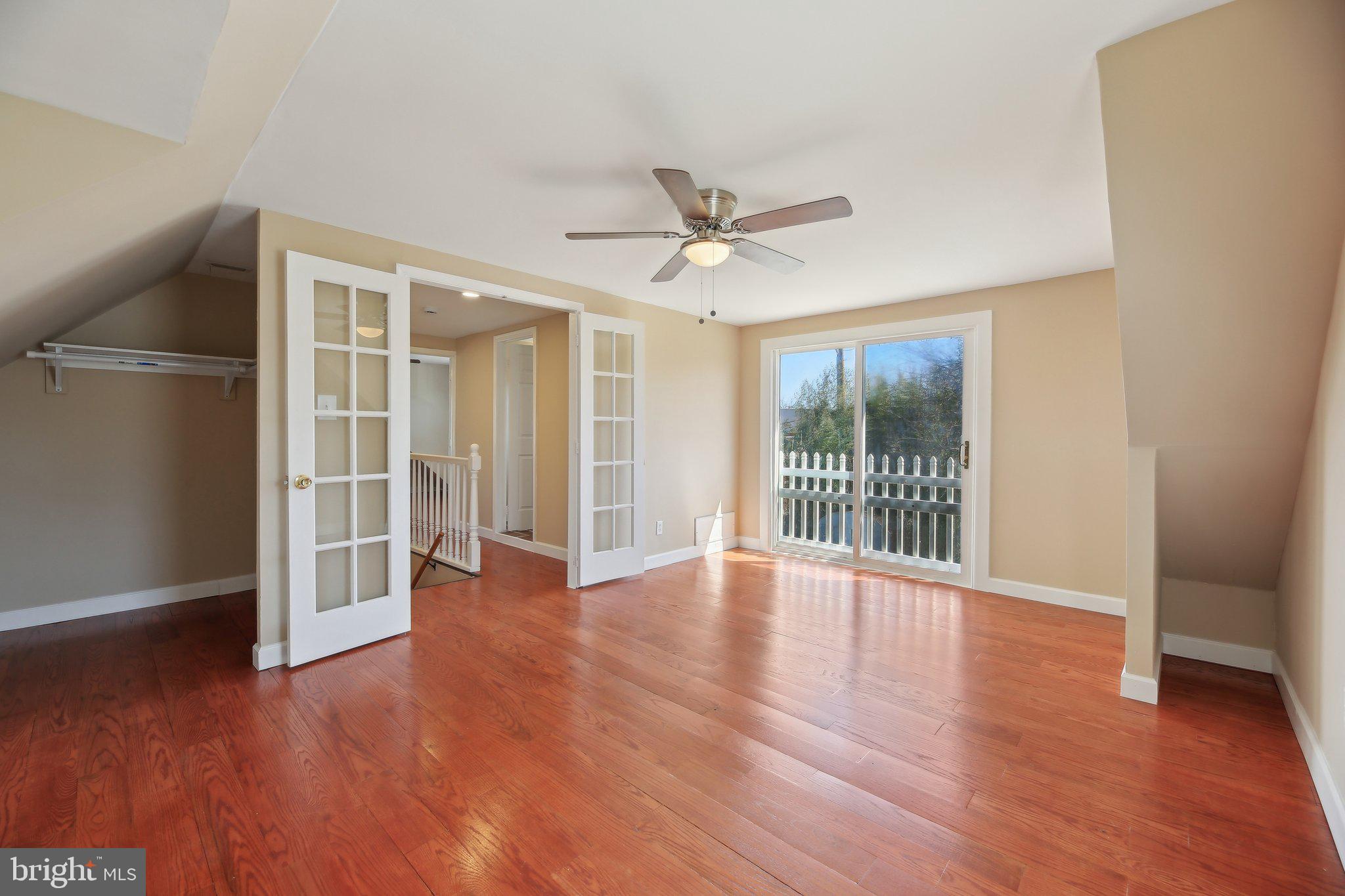 3547 Milford Mill Road Baltimore, MD 21244 - Photo 20 of 44 a view of an empty room with wooden floor and a window