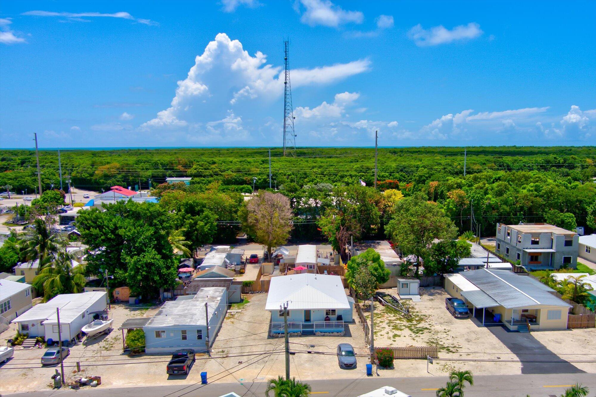 939 Plantation Road Key Largo, FL 33037 - Photo 35 of 38 a picture of houses with outdoor space and street view