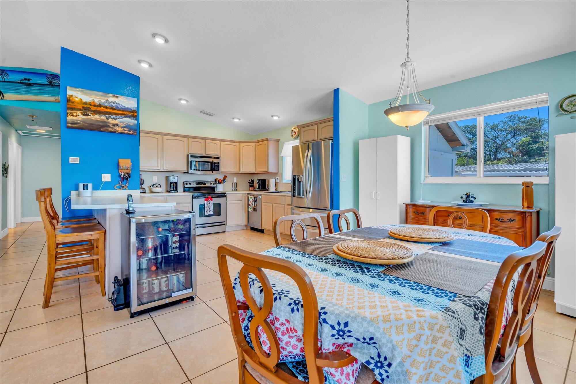 939 Plantation Road Key Largo, FL 33037 - Photo 5 of 38 a kitchen with stainless steel appliances granite countertop a sink and a refrigerator