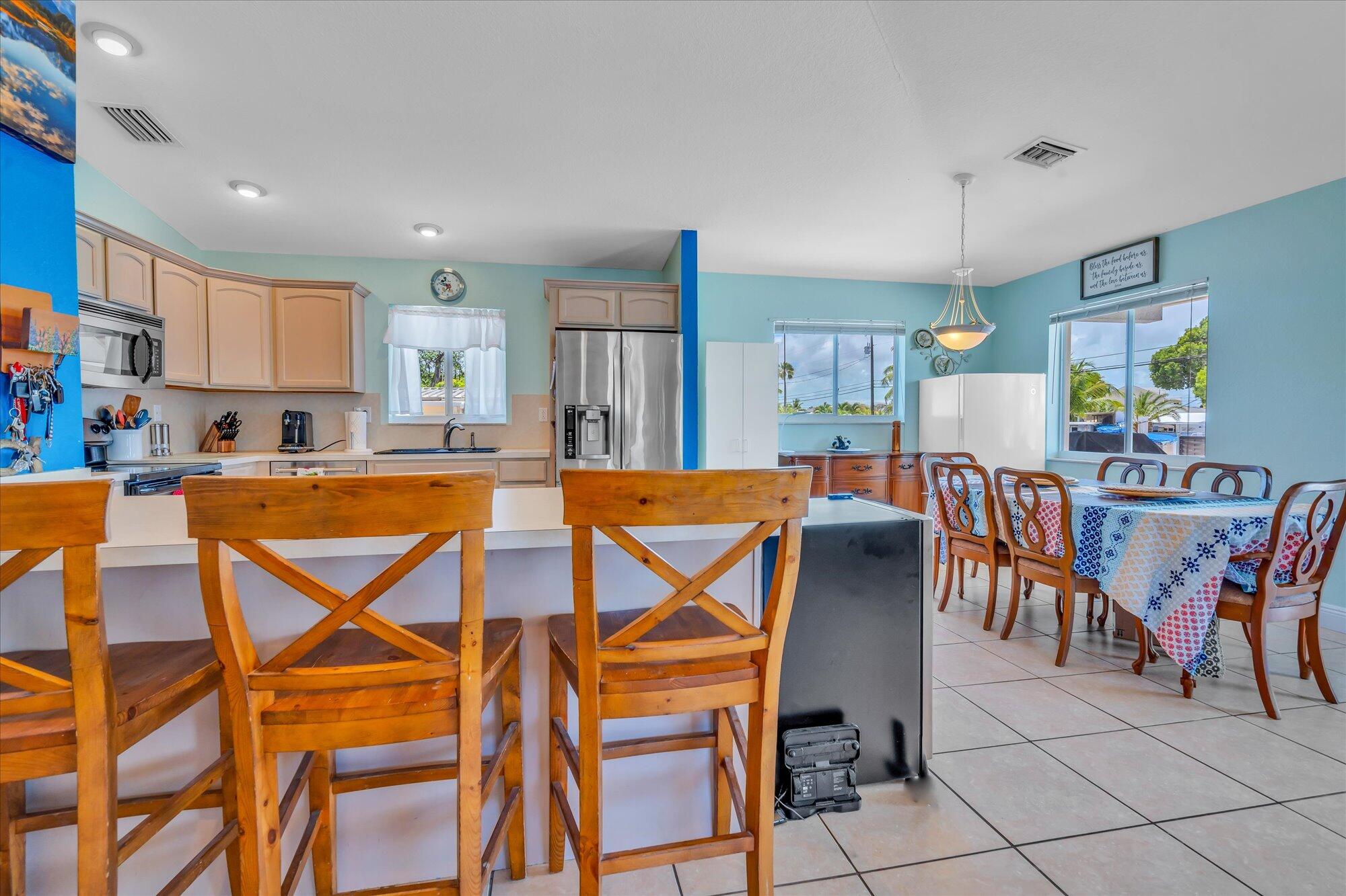 939 Plantation Road Key Largo, FL 33037 - Photo 9 of 38 a view of a dining room with furniture