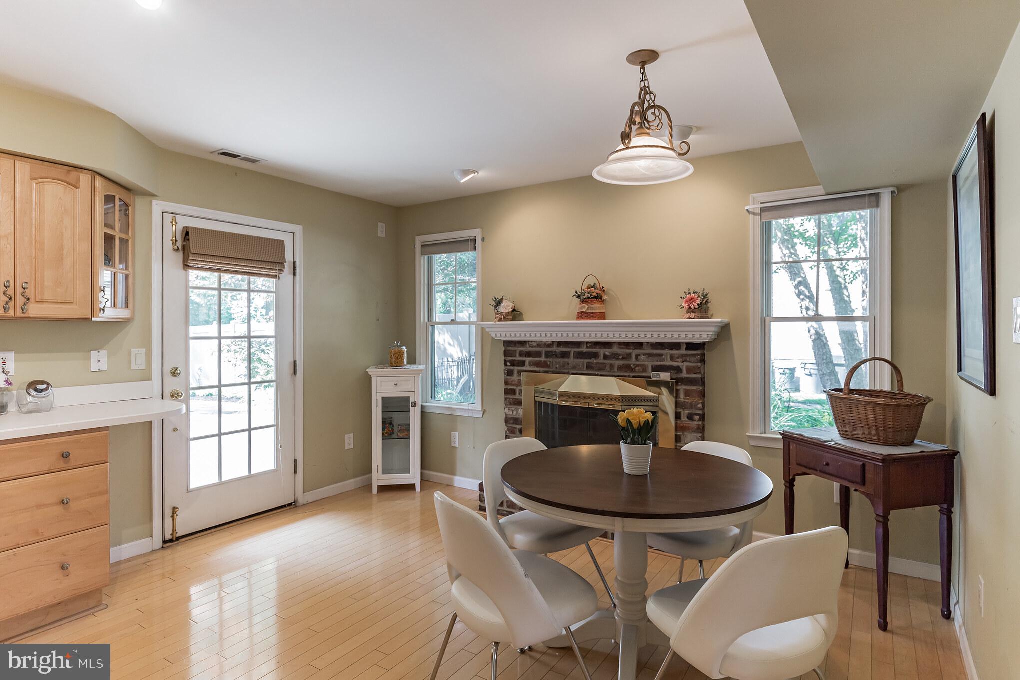 129 Round Hill Road Voorhees, NJ 08043 - Photo 23 of 33 In-law Fireplace place and door to patio & pool