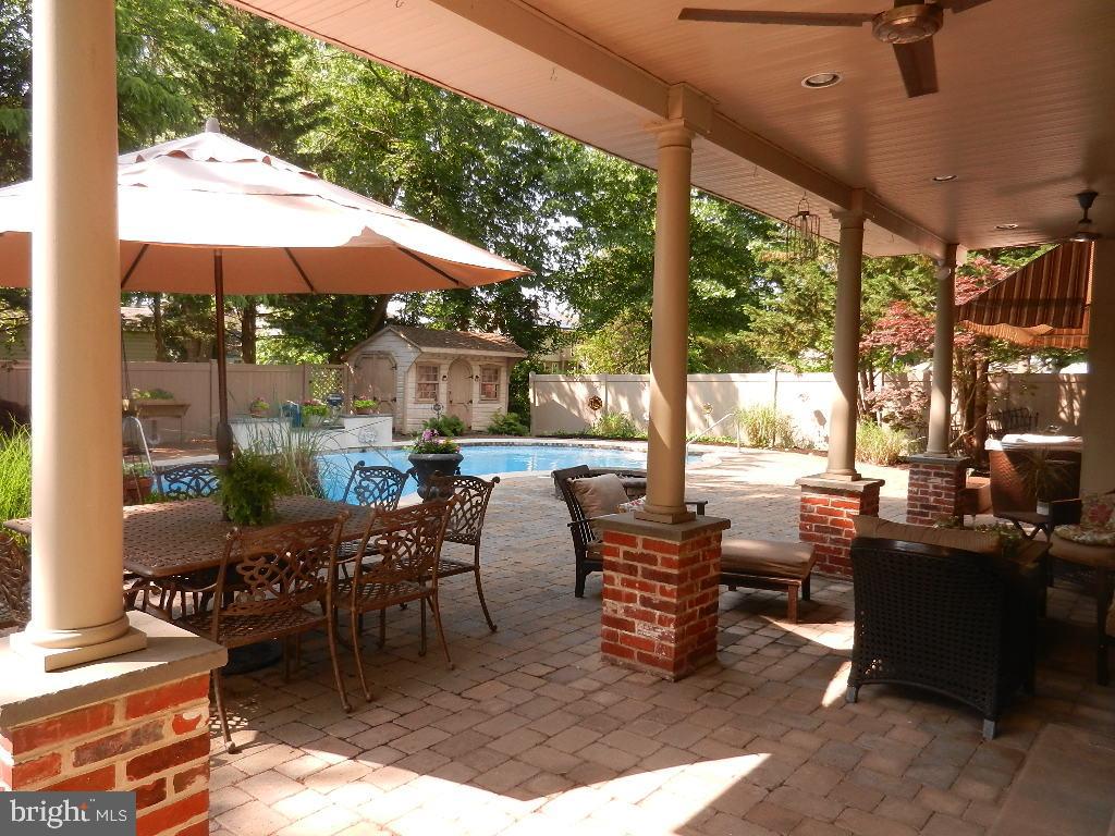129 Round Hill Road Voorhees, NJ 08043 - Photo 33 of 33 Covered Veranda and view of Pool