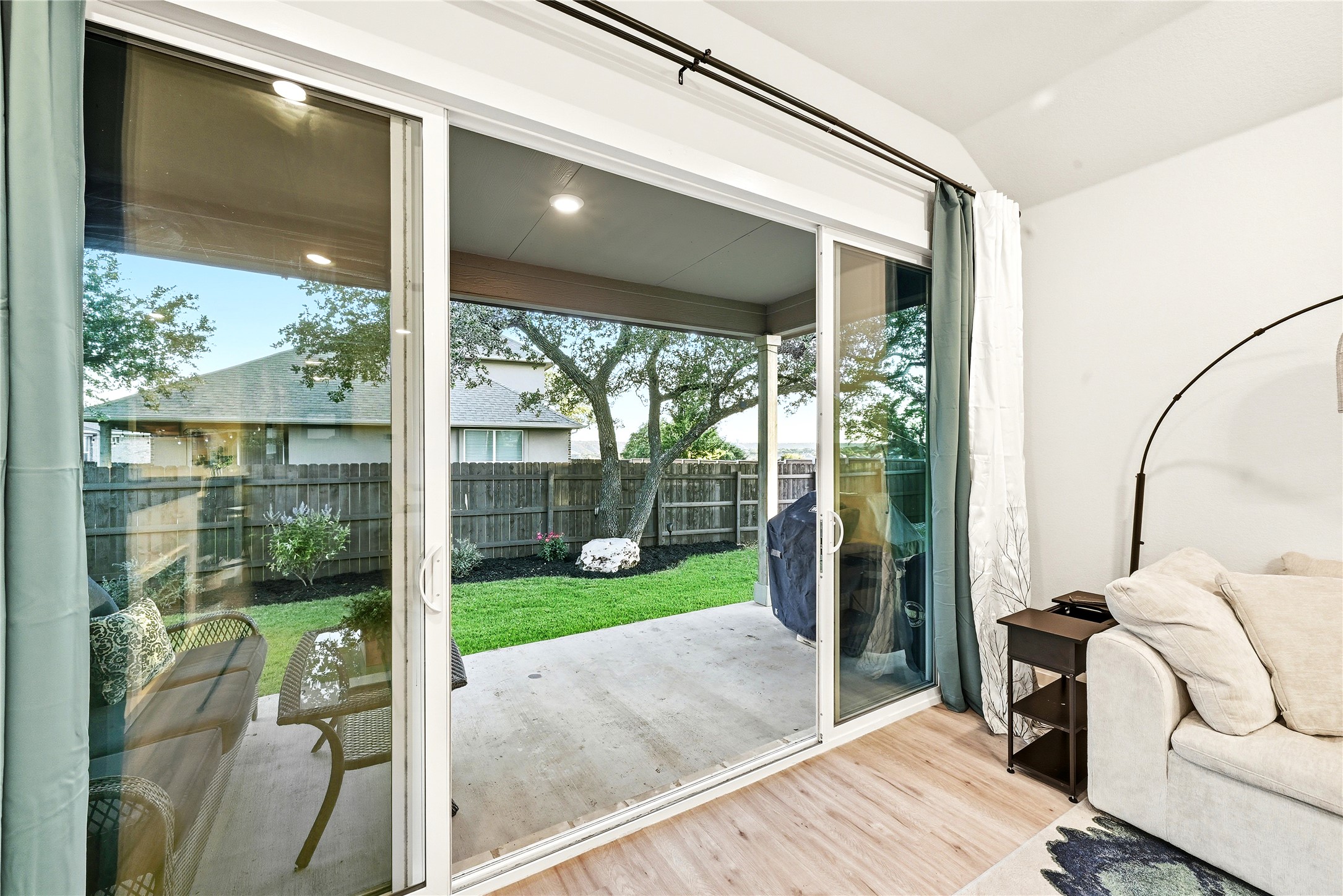 4420 Ingram Road Georgetown, TX 78628 - Photo 26 of 40 Sliding glass doors open to a generous patio and a vibrant green yard, perfect for outdoor relaxation.