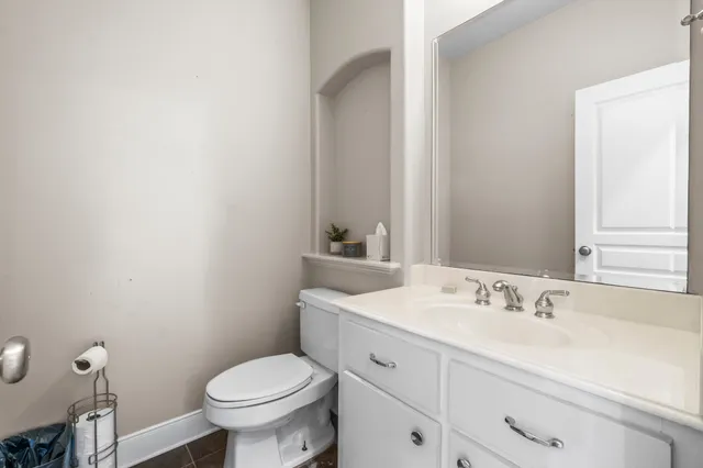 a bedroom with a large bed and a large window