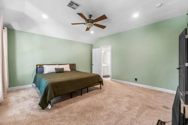a bathroom with a tub a sink and mirror