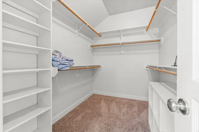 a view of washer and dryer with wooden floor