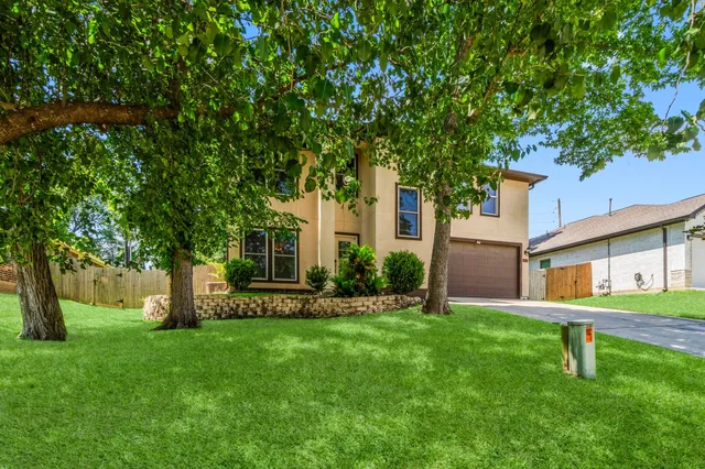 a front view of a house with garden