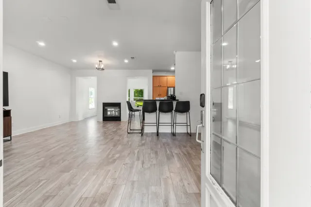 a view of kitchen with furniture and wooden floor