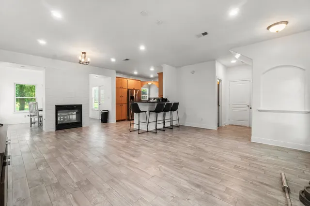 a view of a kitchen with furniture and a fireplace
