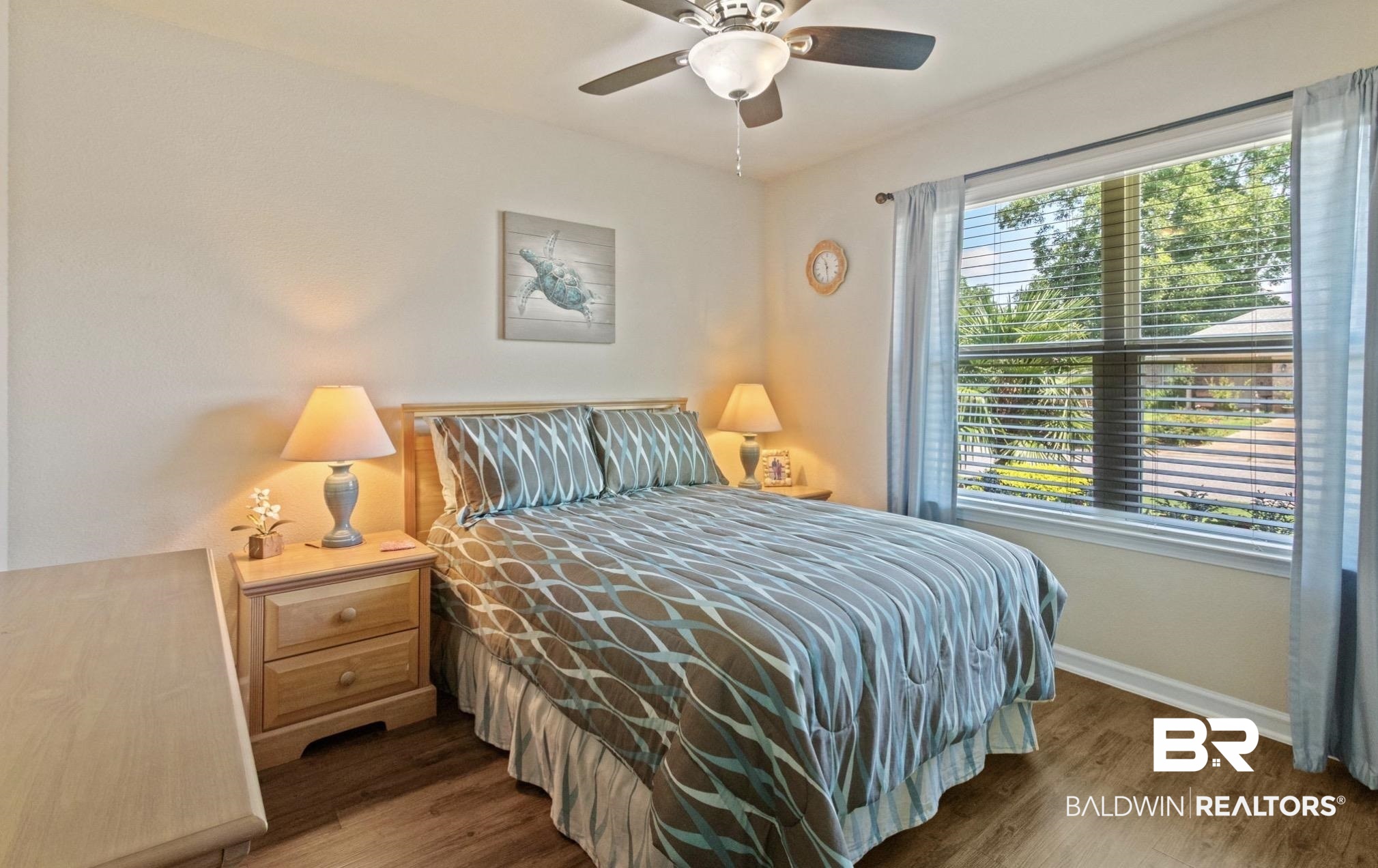 1676 Abbey Loop Foley, AL 36535 - Photo 18 of 31 Spacious room featuring wood-finish flooring, a large window with horizontal blinds, and a ceiling fan with integrated lighting
