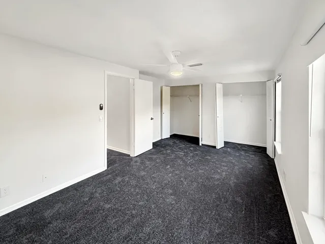 a bathroom with a shower toilet and sink