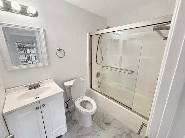 a bathroom with a sink a toilet and a bathtub