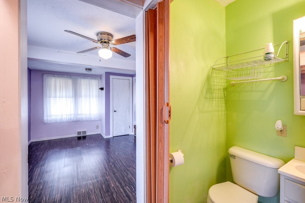 851 Ranney Street Akron, OH 44310 - Photo 18 of 30 Bathroom with ceiling fan, vanity, toilet, and hardwood / wood-style flooring