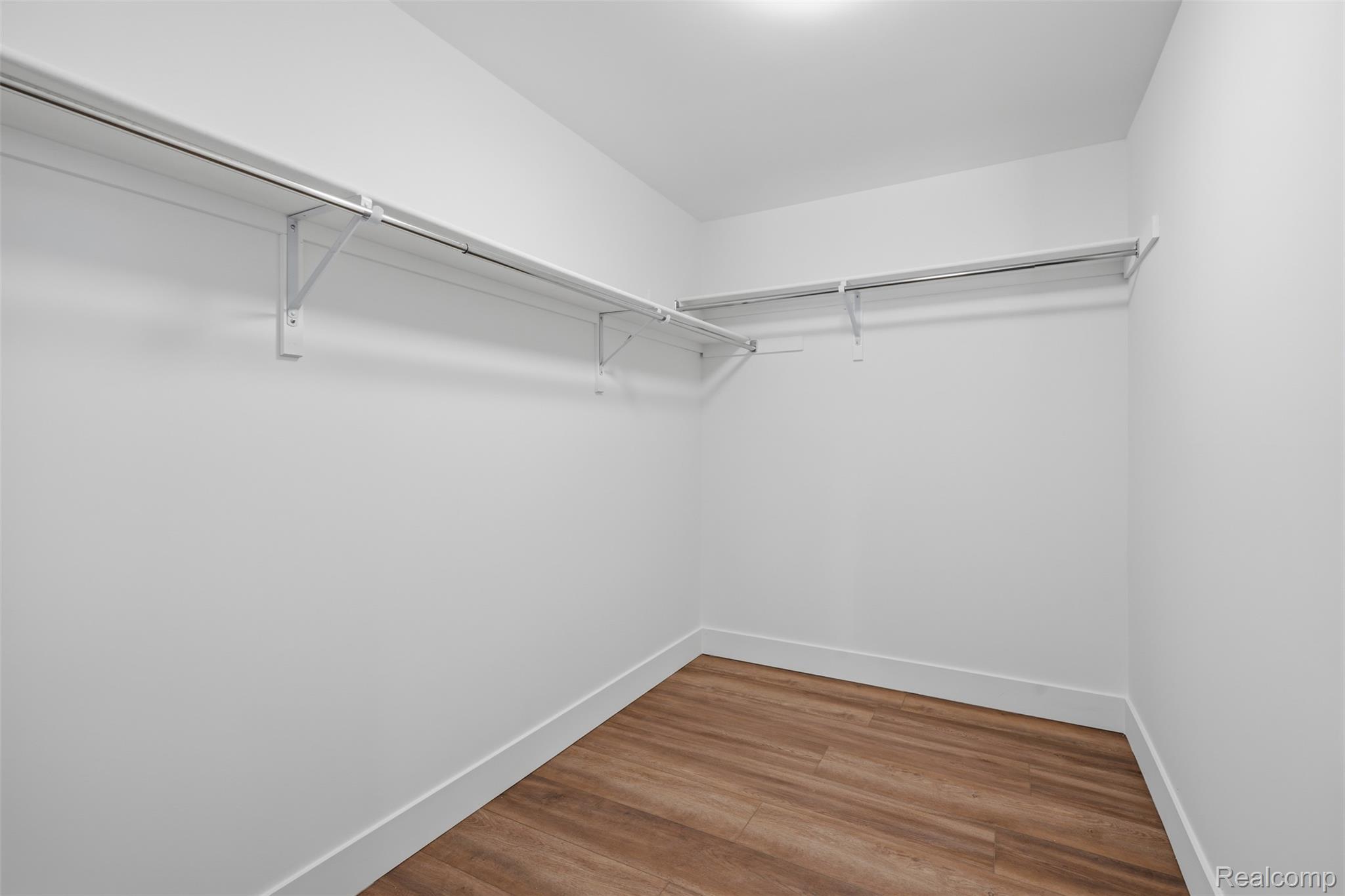 4655 Denton Road Canton, MI 48188 - Photo 25 of 54 Walk-in closet with wood-finish flooring, white walls, and built-in shelving